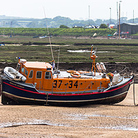 Buy canvas prints of Lifeboat sitting on the mud flaps at Wells-Next-Se by Clive Wells
