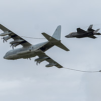 Buy canvas prints of Lockheed C-130 with Lockheed Martin F-35 Lightning by Clive Wells