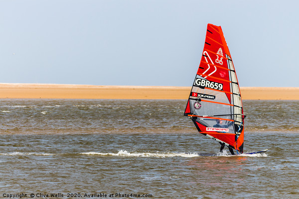 Wind surfing at Wells-Next-Sea in North Norfolk  Picture Board by Clive Wells