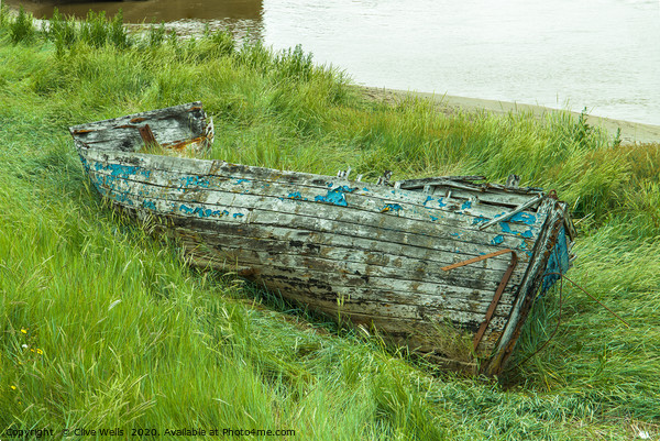 Old wrecked rowing boat at King`s Lynn in Norfolk Picture Board by Clive Wells