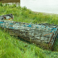 Buy canvas prints of Old wrecked rowing boat at King`s Lynn in Norfolk by Clive Wells