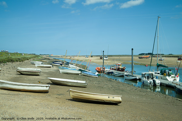 Rowing boats at low tide seen at Wells-Next-Sea in Picture Board by Clive Wells