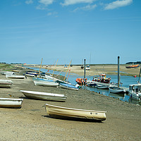 Buy canvas prints of Rowing boats at low tide seen at Wells-Next-Sea in by Clive Wells