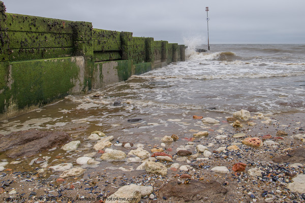 Waves breaking at Hunstanton in Norfolk Picture Board by Clive Wells