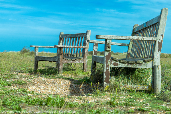 Well worn seats at Snettisham beach in Norfolk Picture Board by Clive Wells