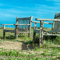 Buy canvas prints of Well worn seats at Snettisham beach in Norfolk by Clive Wells