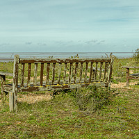 Buy canvas prints of Wooden benches overlooking the Wash at Snettisham by Clive Wells