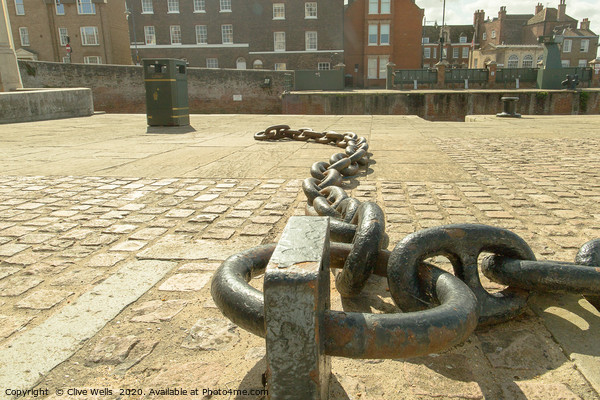 Chains on the old docks at Kings Lynn in Norfolk Picture Board by Clive Wells
