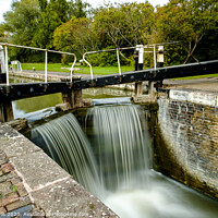 Buy canvas prints of Overflowing lock gates at Stoke Brurne. by Clive Wells