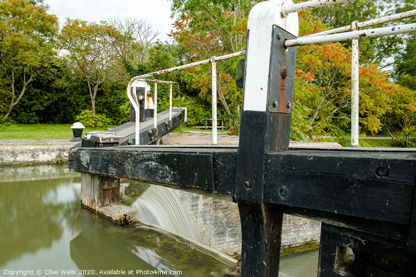 Overflowing lock gates. Picture Board by Clive Wells