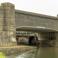Buy canvas prints of Canal boat under the bridge by Clive Wells