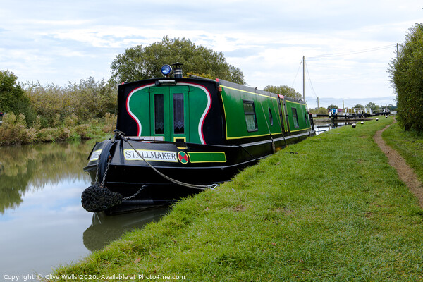 Narrow boat moored up in front of lock gates. Picture Board by Clive Wells