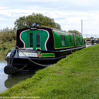 Buy canvas prints of Narrow boat moored up in front of lock gates. by Clive Wells