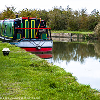Buy canvas prints of Colourful narrow boat on the Grand Union Canal by Clive Wells