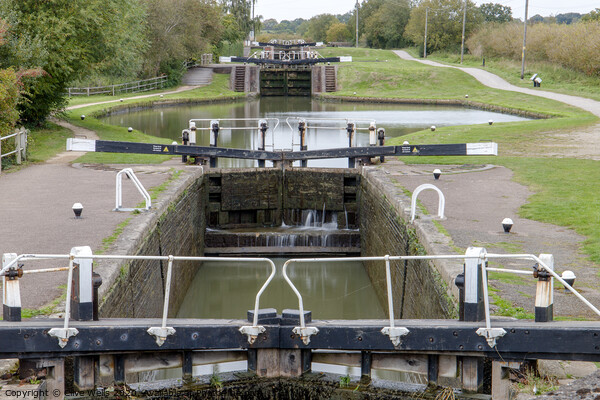 Row of lock gates at Stoke Bruene, Northamptonshir Picture Board by Clive Wells
