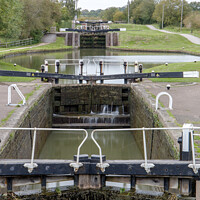 Buy canvas prints of Row of lock gates at Stoke Bruene, Northamptonshir by Clive Wells