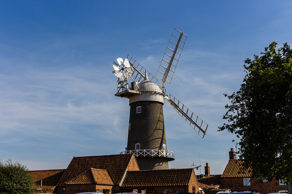 Bircham Windmill in Norfolk seen in bright sunlight Picture Board by Clive Wells