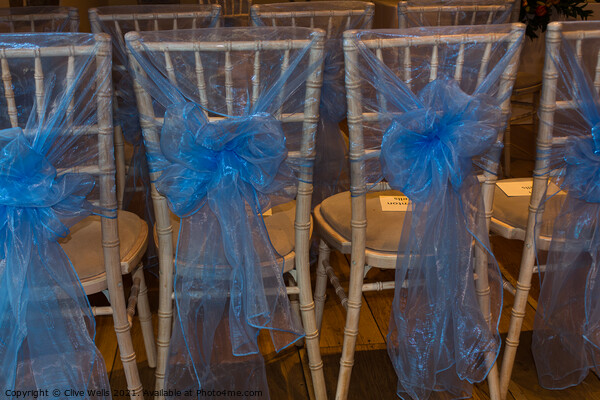 Chairs with blue ribbons Picture Board by Clive Wells