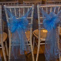 Buy canvas prints of Chairs with blue ribbons by Clive Wells