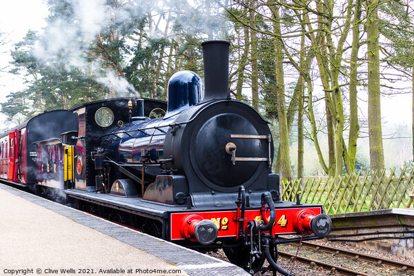 Steam train at Holt Station in North Norfolk Picture Board by Clive Wells