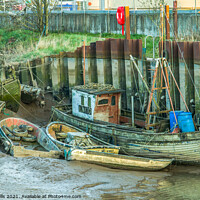 Buy canvas prints of Abandoned boats at low tide by Clive Wells