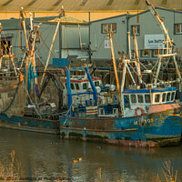 Buy canvas prints of Two fishings boats at low tide by Clive Wells