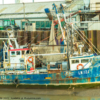 Buy canvas prints of Grounded fishing boat by Clive Wells