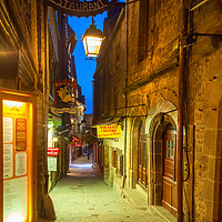 Buy canvas prints of Looking down Grand Rue, Mont Saint Michel, France by Lenscraft Images