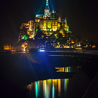 Buy canvas prints of Mont Saint Michel, France lit up at night by Lenscraft Images