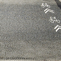 Buy canvas prints of Bike lane and direction arrows by Valerio Rosati