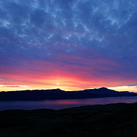 Buy canvas prints of Sunsetting over Portree and the Storr, Isle of Sky by Phill Thornton