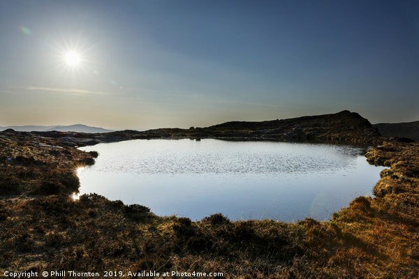 Sunset over Loch na Clarlaich to the Isle of Skye. Picture Board by Phill Thornton