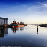 Buy canvas prints of Early morning sunshine over Middlesbrough Docks by Phill Thornton