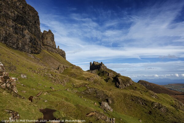 Blue skies over the Quiraing cliffs, Skye. Picture Board by Phill Thornton