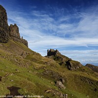 Buy canvas prints of Blue skies over the Quiraing cliffs, Skye. by Phill Thornton