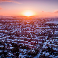 Buy canvas prints of Sunrise over a snowy suburb by Richard Nicholls
