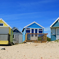 Buy canvas prints of Seaside colourful beach huts by Steve Mantell