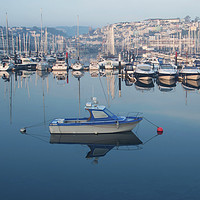 Buy canvas prints of Sunrise over boats moored in Brixham harbour by Steve Mantell