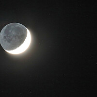 Buy canvas prints of Crescent Moon with Earthshine by Susan Snow