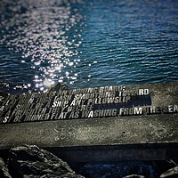 Buy canvas prints of Wellington Harbour Sea Wall Poem in concrete by Oliver Southgate