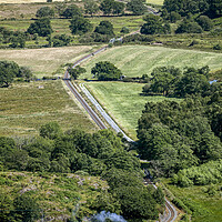 Buy canvas prints of Welsh Highland Railway Garratt No87 between Nantmor and Pont Croesor.  by David Thurlow