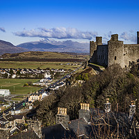 Buy canvas prints of Harlech Castle and Mount Snowdon in North Wales by David Thurlow