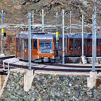 Buy canvas prints of The Gornergratbahn descending towards the Zermatt  by David Thurlow