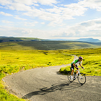 Buy canvas prints of Cyclist on Fleet Moss by Jon Sparks
