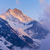 Buy canvas prints of Evening light and mist on the Jungfrau by Jon Sparks
