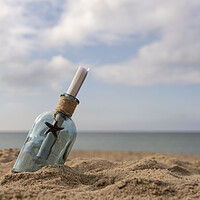 Buy canvas prints of Message in a bottle on the sand by Anthony Hart