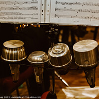 Buy canvas prints of Trumpet mutes in a row with sheet music on a stand by Ben Delves
