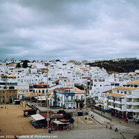 Buy canvas prints of Serene Charm of Albufeira's Old Town by Ben Delves