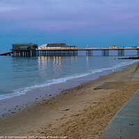 Buy canvas prints of Cromer Pier in the Pink light by Heidi Hennessey