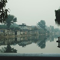 Buy canvas prints of Hutongs through the smog in Beijing by Sophie Shoults